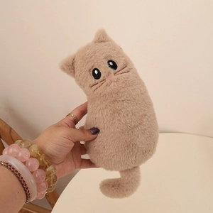 Detail of plush cat pencil case showing soft faux fur texture and embroidered feline face