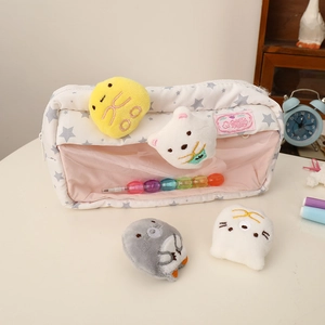 Detail of star pattern pencil case with transparent window and cute plush charms