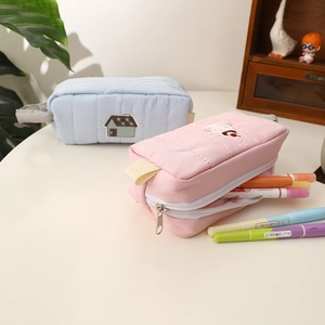 Quilted fabric pencil cases in blue house and pink cupcake designs with large capacity