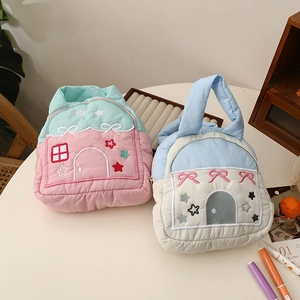 Quilted house-shaped handbags with detailed embroidery and soft padded carry handles