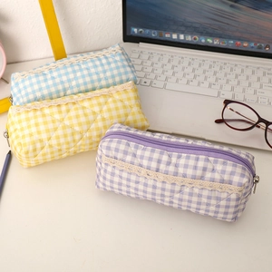 Quilted plaid pencil cases in blue, yellow, and purple with elegant white lace trim