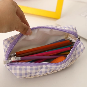 Detail view of large capacity purple plaid pencil case showing interior with color pencils