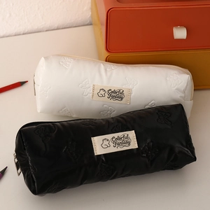 Close-up of bow-embossed PU pencil cases with Colorful Fantasy bear logo and metal zipper