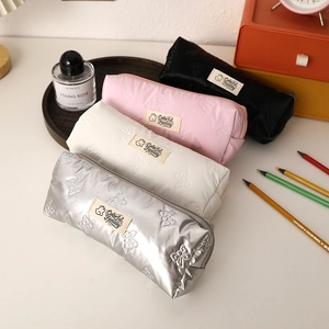 Macro view of aesthetic bow pattern stationery bags in silver, white, pink and black colors