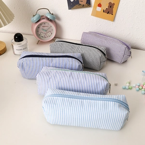 Set of five large capacity seersucker pencil cases with striped patterns and top zippers