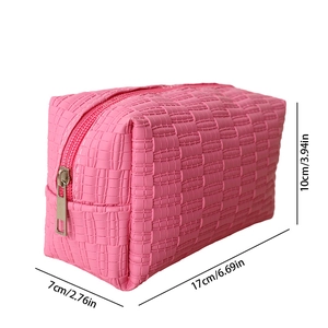 Pink quilted PU leather cosmetic bag with dimensions 17x10x7cm and silver zipper detail