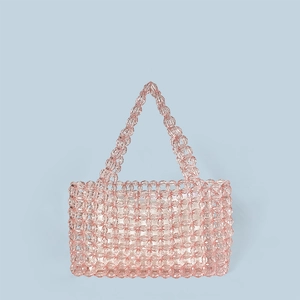 Close-up of pink handmade woven crystal beaded tote bag with dual handles