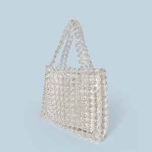 Detailed view of handmade clear acrylic beaded tote bag with inner pouch and floral weave