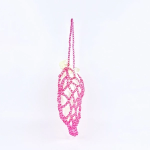 Detailed macro view of pink translucent beads texture on handmade woven shoulder bag