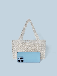 Handmade clear crystal beaded handbag with floral weave and white fabric inner bag