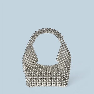 Detail of silver metallic beaded handmade Boston hobo handbag with high-shine finish