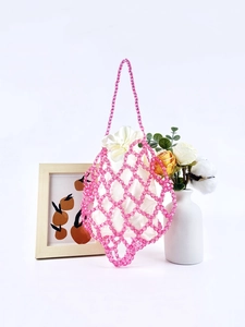 Pink beaded woven mesh tote bag with satin drawstring liner on a minimalist white background