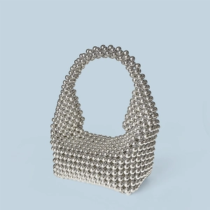 Detail showing the intricate silver beaded texture of this handcrafted Boston pearl bag