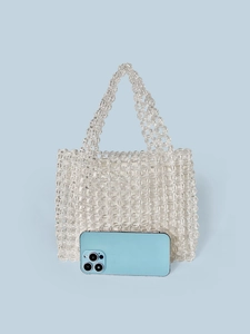 Handmade clear acrylic beaded tote bag with inner lining and top handles on blue background