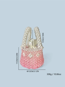 Detail view of pink crystal beads and white pearls on the handmade beach bag