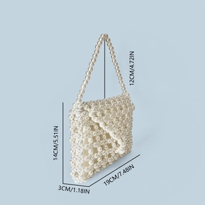 Detail view showing dimensions of handmade woven faux pearl bead handbag in white