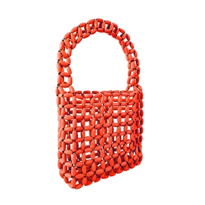 Close-up of red beaded handbag with oval glossy beads and hollow woven structure