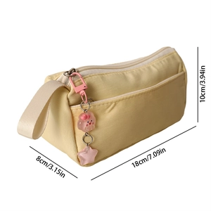 Detail view of large capacity cream yellow pencil case with size 18x10x8cm and cute charm