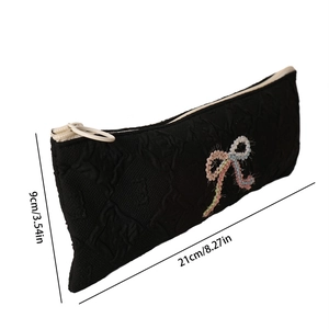 Detailed size view of black jacquard bow pencil case showing 21cm length and 9cm height