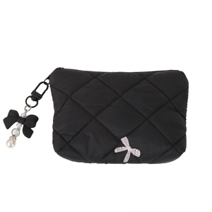 Quilted black makeup bag with bow embroidery and pearl keychain pendant on white background