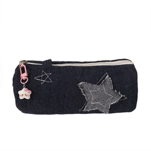Blue denim star pencil case with cute pink charm and spacious zipper compartment for students