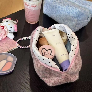Pink leopard print plush makeup bag for women featuring a polka dot lining for travel