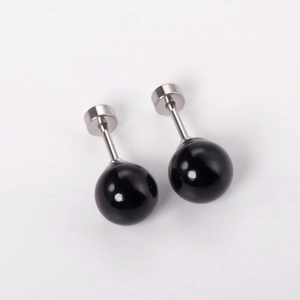 Detail of black ball stud earrings with secure stainless steel screw-back closure