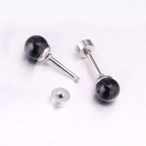 Detailed view of black pearl barbell earrings with screw-back design and stainless steel post