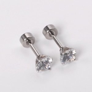 Macro detail of clear round zirconia studs with classic four-prong setting and secure backs