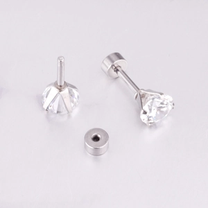Macro shot of silver four-prong round white cubic zirconia stud with flat back earring plug