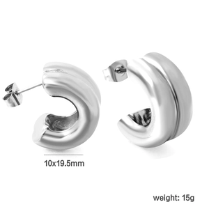 Detail view of silver double C-shaped earrings with 10x19.5mm size and 15g weight specs