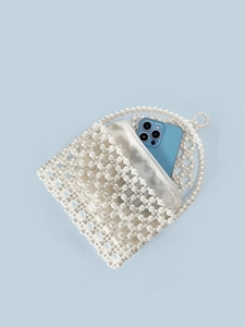 Handmade pearl beaded tote bag with satin inner pouch showing phone storage capacity