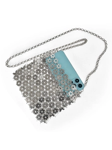 Detail showing shiny silver metal flower cutout phone bag with elegant chain strap