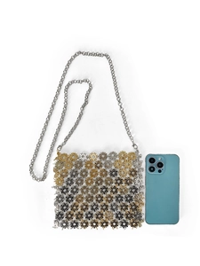 Detailed view of handmade metal floral crossbody bag with gold and silver link pattern