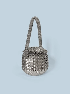Detailed view of handcrafted silver metal sequin bag with unique spherical weave texture
