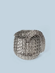Macro detail of silver sequin woven sphere handbag with metallic mesh texture