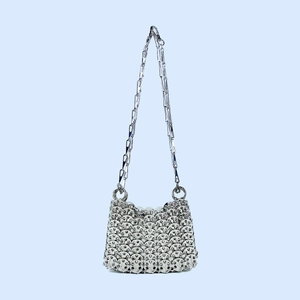 Detail of silver handmade chainmail shoulder bag with metallic sequins and crossbody chain