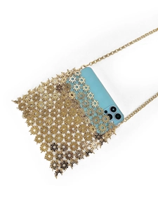 Detail of gold daisy cutout metal phone bag with slim chain strap and blue phone inside