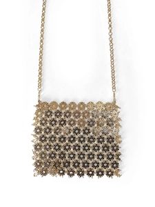 Detailed macro view of vintage hollow floral metal chain link crossbody phone bag in gold
