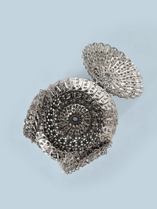 Top view of handmade silver sequin bag showing intricate woven metal chain structure