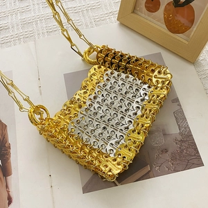 Detailed view of handmade silver and gold sequin link crossbody bag with chain strap