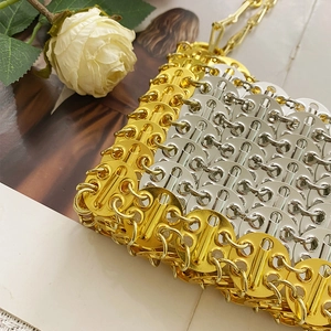 Detail of silver and gold metal sequins handcrafted into a vintage industrial chain shoulder bag