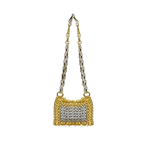 Detail of silver and gold sequin woven crossbody bag with metallic chain strap