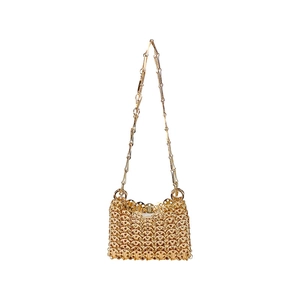 Close-up of handmade gold metal ring-mesh woven handbag with metallic chain strap
