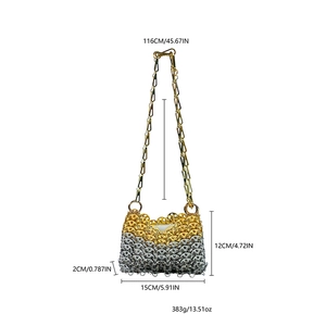 Detail of handmade metallic chainmail bag with dimensions and gold-silver gradient finish