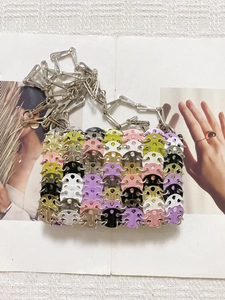 Detailed view of handmade colorful sequin bag with silver chain and metal rings