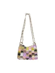 Detailed view of colorful disc sequins and silver chain on a stylish shoulder bag