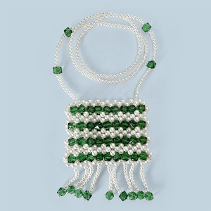 Detailed view of handmade pearl and green crystal mini crossbody bag with fringes