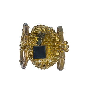 Detail of amber bead handbag with bamboo handle showing interior space for lipsticks