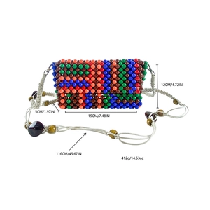Detailed view of colorful beaded crossbody bag with dimensions 19x5x12cm and rope strap